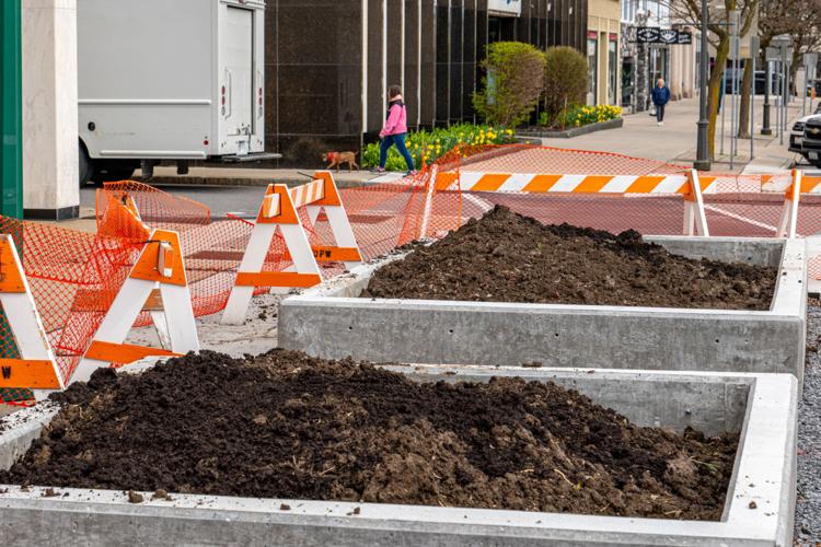 Work resumes on downtown planters