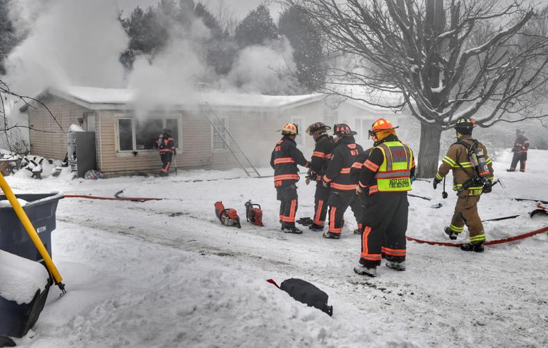 Fire departments battle structure fire on Heath Road in Potsdam St