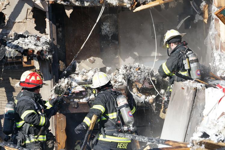 Chaumont garage destroyed in fire, structure torn away from house to