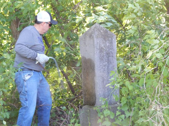 Volunteers work together to clean up Massena’s St. Peter’s Cemetery