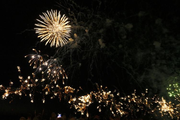 Harborfest fireworks fill the sky over Oswego Harbor Arts and