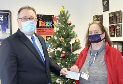 Fulton Lions donate $1,500 to Catholic Charities