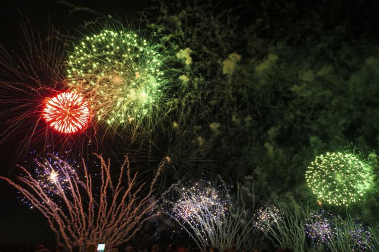 Harborfest fireworks fill the sky over Oswego Harbor Arts and
