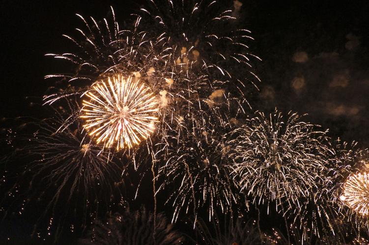 Harborfest fireworks fill the sky over Oswego Harbor Arts and