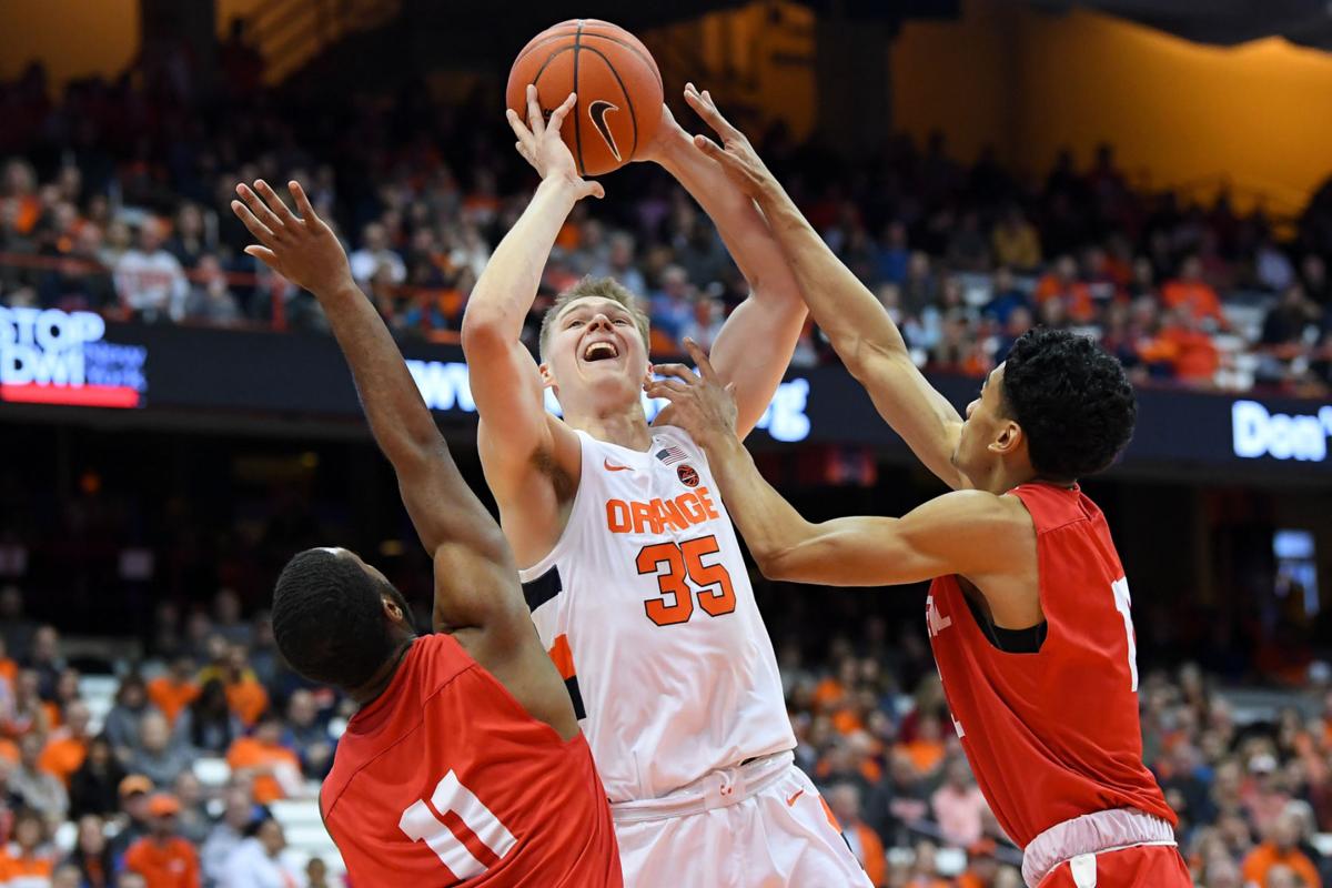 College Basketball Syracuse S Boeheims Hold Off Cornell S Boeheim