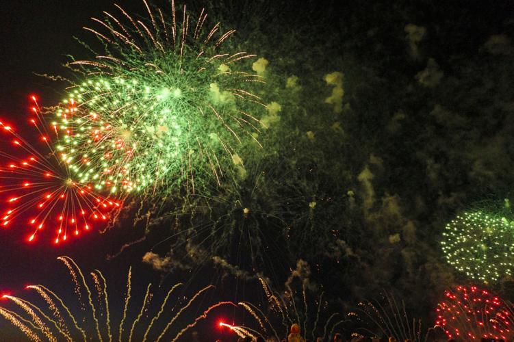 Harborfest fireworks fill the sky over Oswego Harbor Arts and