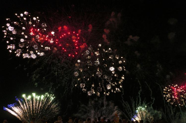 Harborfest fireworks fill the sky over Oswego Harbor Arts and