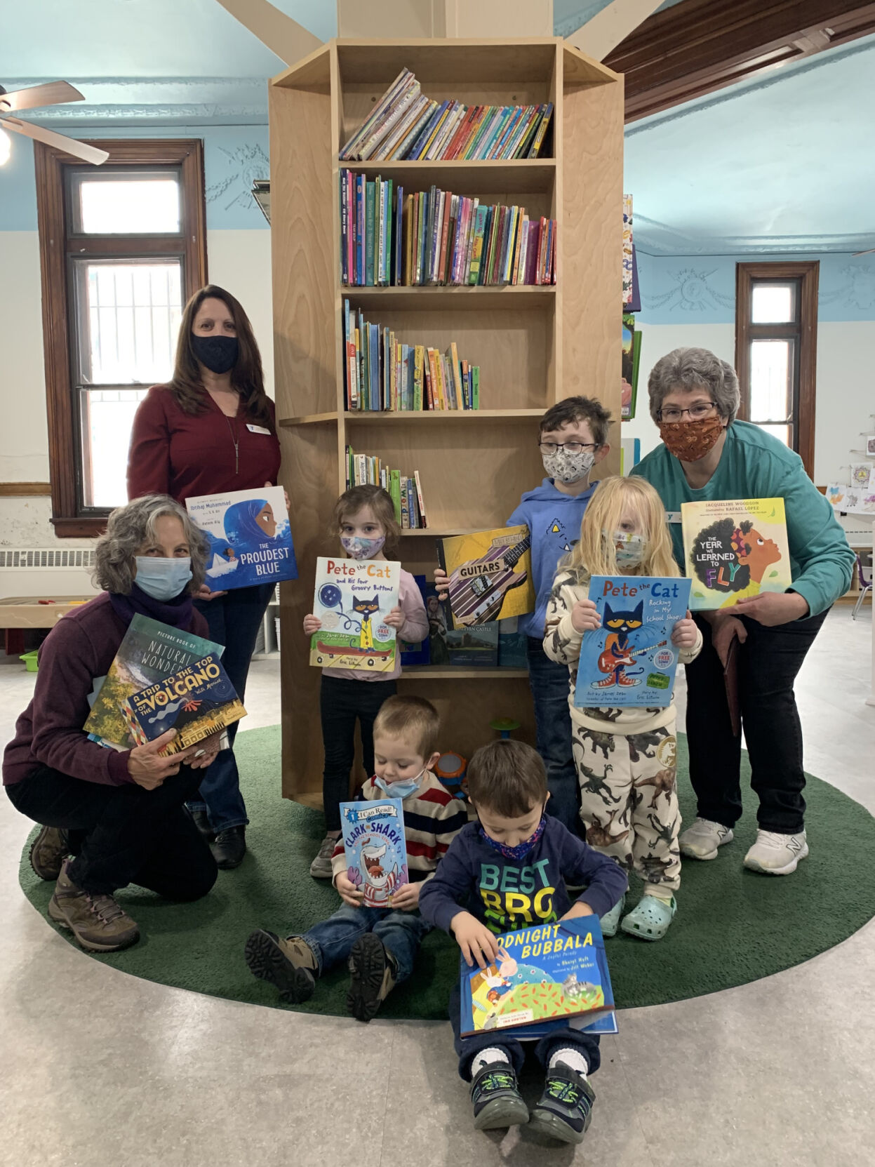 The river’s end bookstore donates books to YMCA Community Giving
