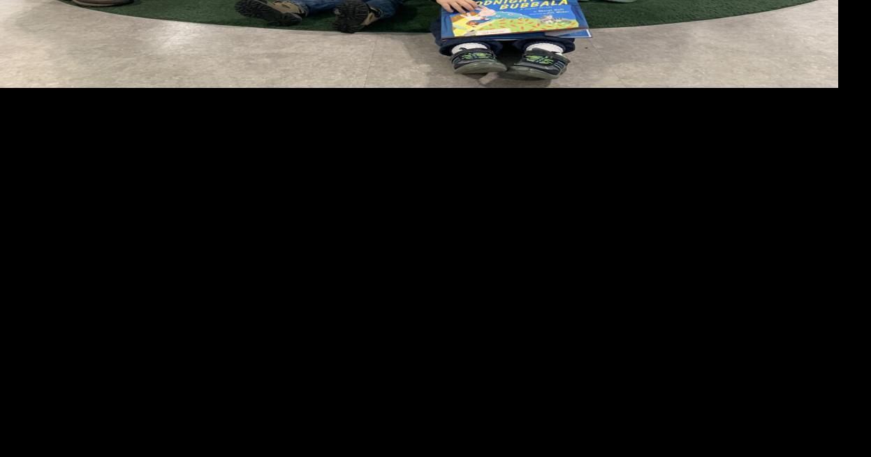 The river’s end bookstore donates books to YMCA Community Giving