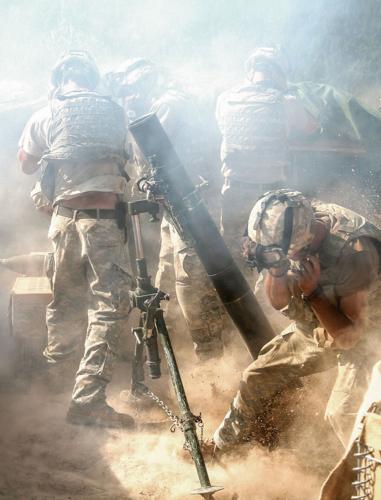 Snapshots of war: Former Fort Drum soldier’s images displayed at museum ...