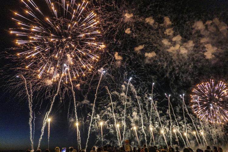 Harborfest fireworks fill the sky over Oswego Harbor Arts and