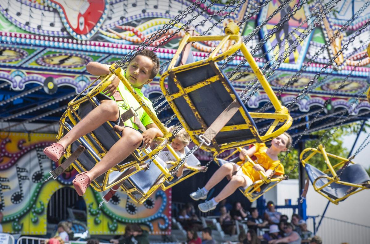 Photo Swinging high at the county fair Kidscontent