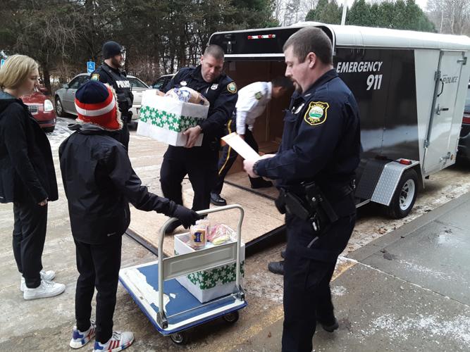 Massena Police Departments delivers holiday boxes for Massena