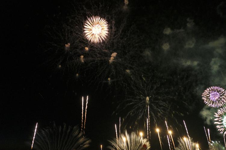 Harborfest fireworks fill the sky over Oswego Harbor Arts and