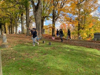 Potsdam athletes help beautify Bayside cemetery