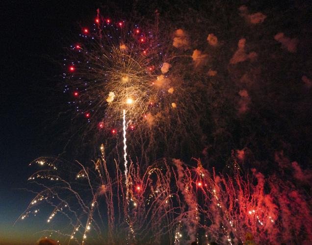 Harborfest fireworks fill the sky over Oswego Harbor Arts and