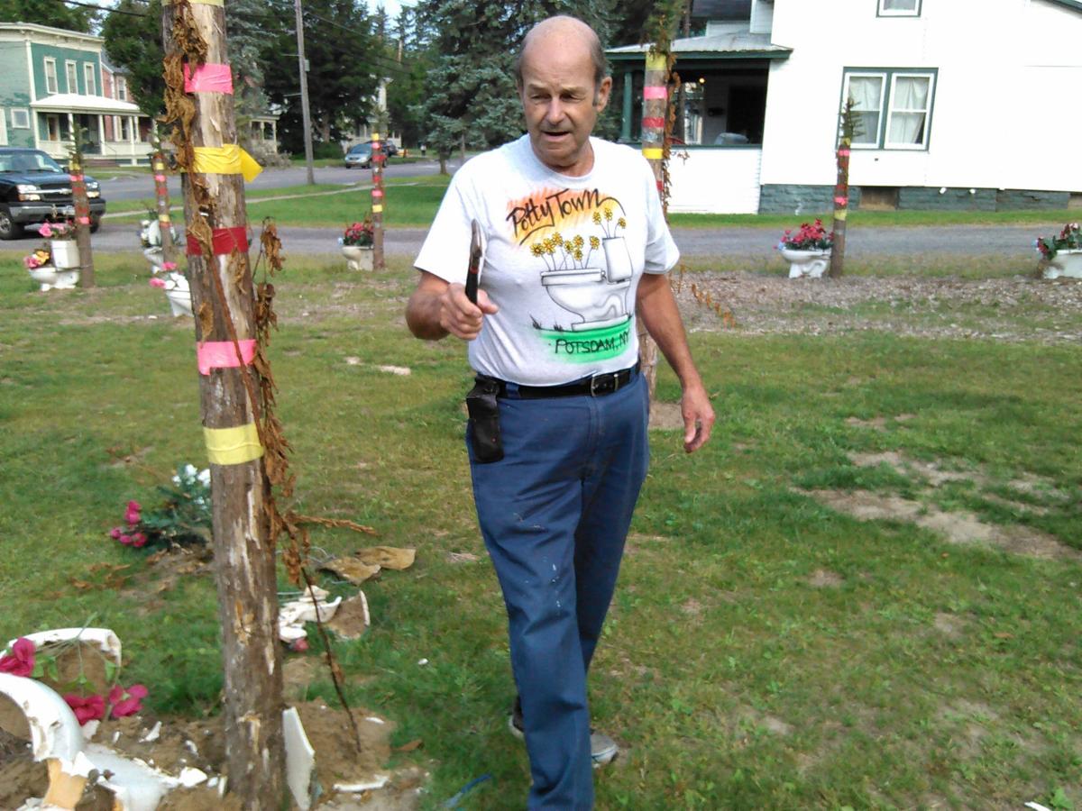 Toilet-garden owner asserts village won’t unseat his art