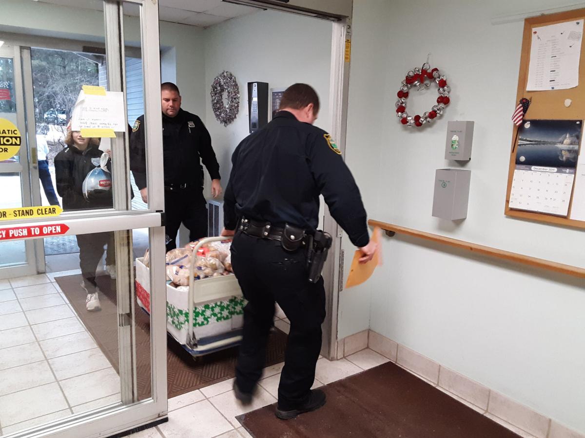 Massena Police Departments delivers holiday boxes for Massena