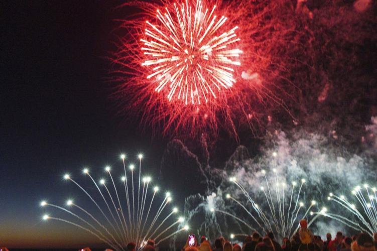 Harborfest fireworks fill the sky over Oswego Harbor Arts and