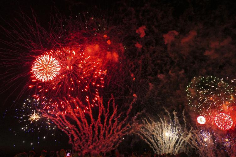 Harborfest fireworks fill the sky over Oswego Harbor Arts and