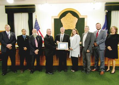 Vrooman receives certificate of appreciation at retirement