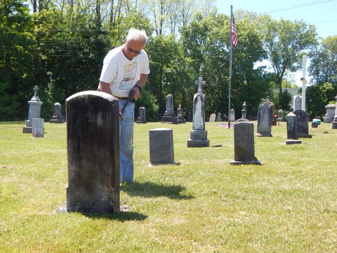 Volunteers work together to clean up Massena’s St. Peter’s Cemetery