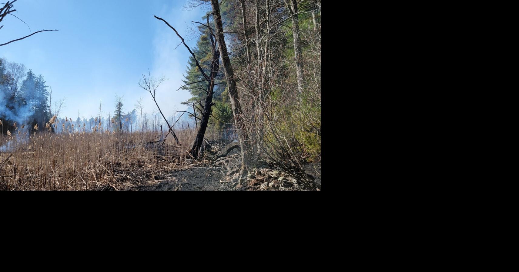 Burn ban still in effect — Firefighters battle large brush, woods fire