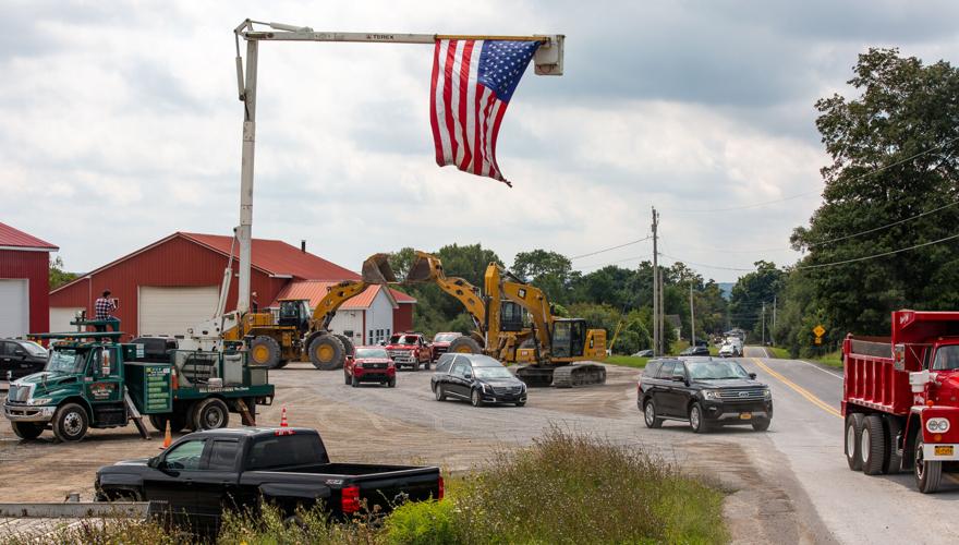 Procession of dump trucks honors late owner of Kings Quarry Community