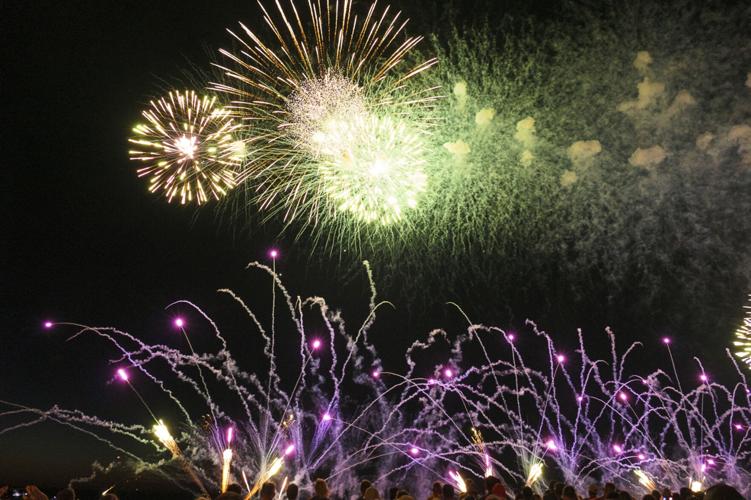 Harborfest fireworks fill the sky over Oswego Harbor Arts and