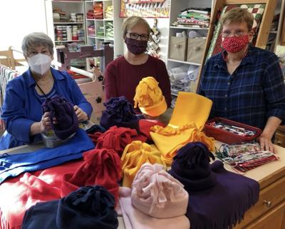 Children’s Board donates hats and scarves