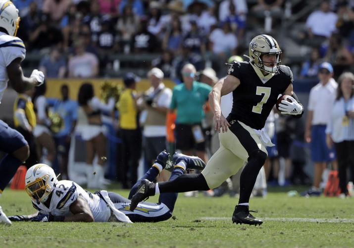 Taysom Hill runs through the Chargers defense