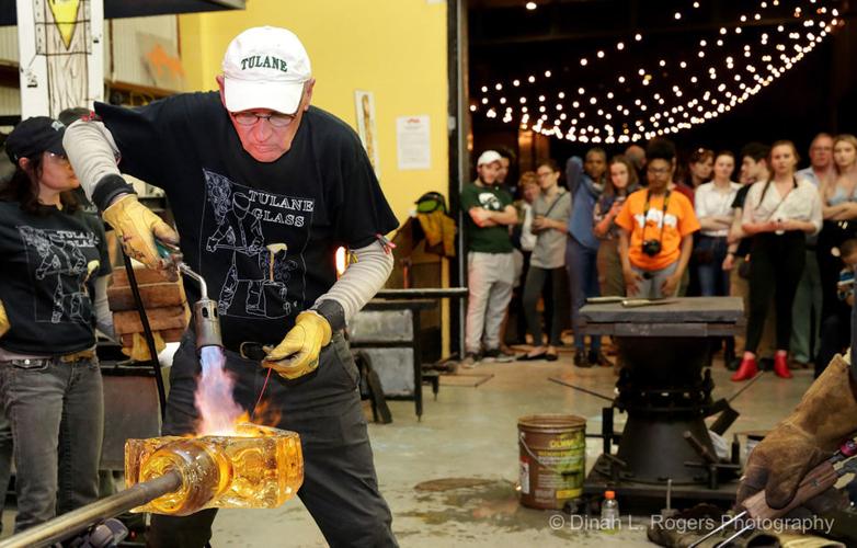 That's hot: Gene Koss and his crew create a glass sculpture for a YAYA crowd