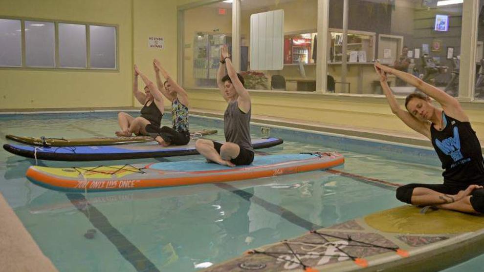 Try the New Yoga Trend: Indoor Standup Paddleboard Yoga Classes