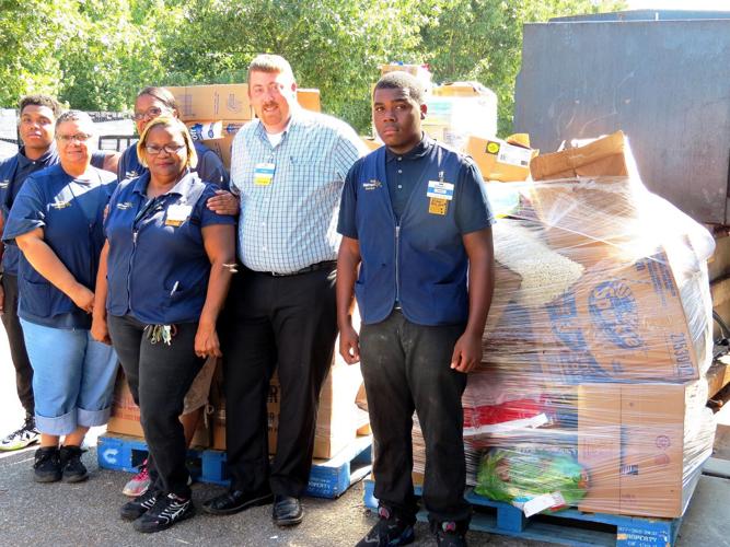 Zachary WalMart lessens impact of flooding through donations to local