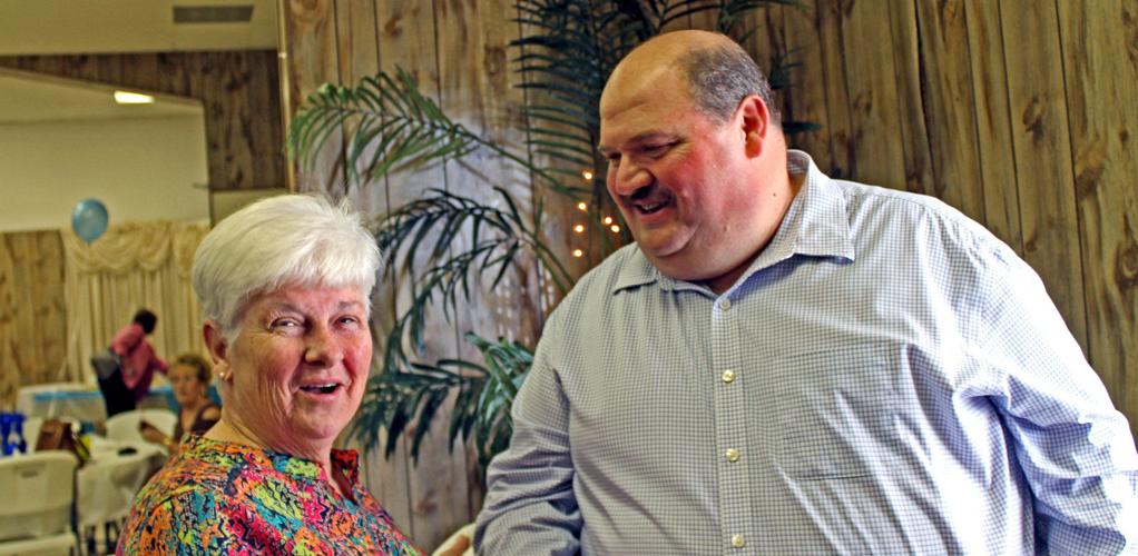 Westwego Police Chief Dwayne 'Poncho' Munch serves senior citizens