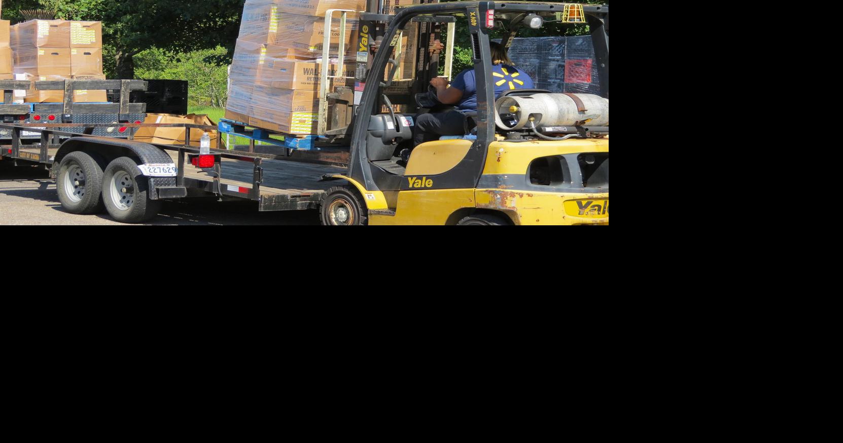 Zachary WalMart lessens impact of flooding through donations to local