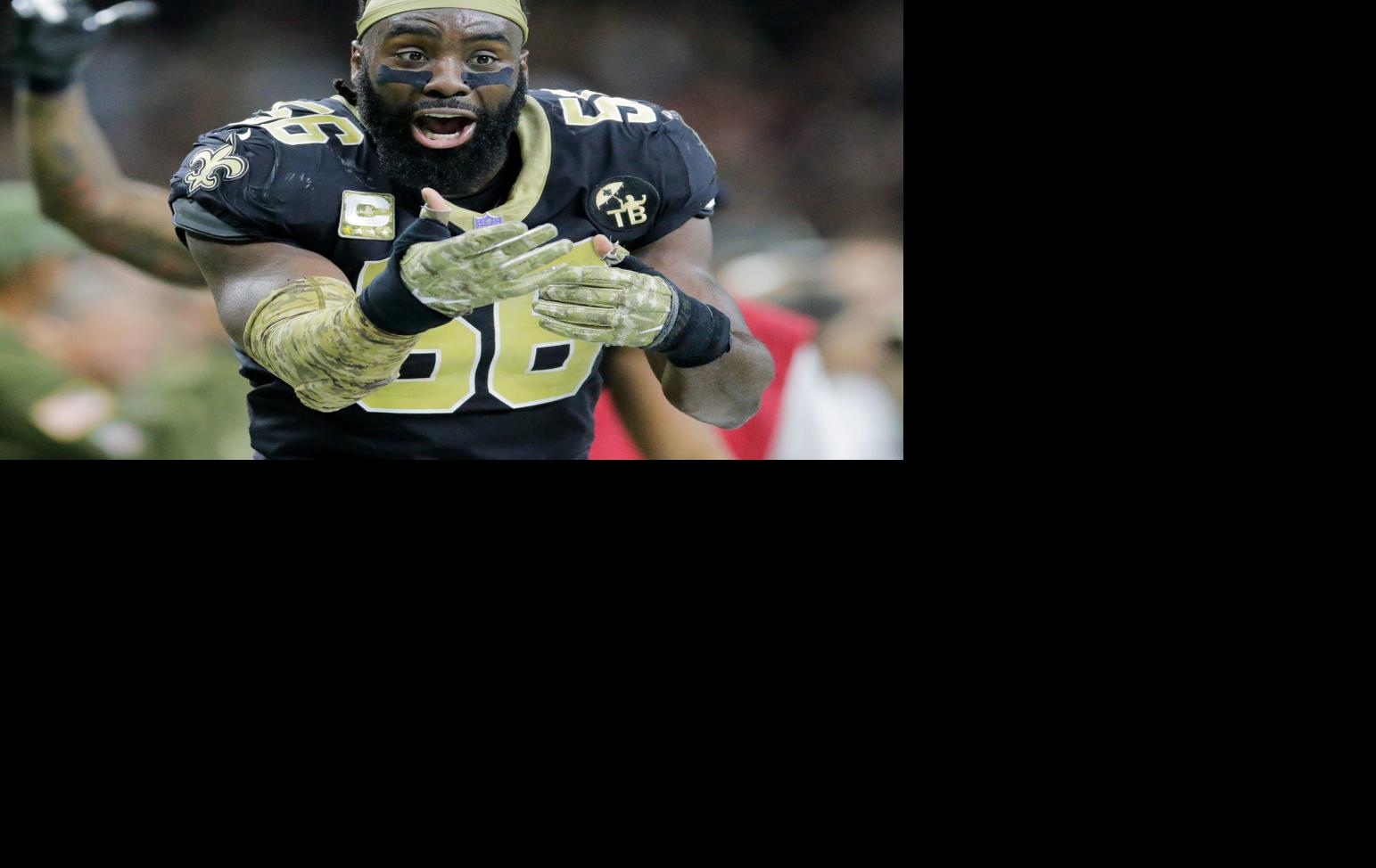 New Orleans Saints linebacker Demario Davis prays before the