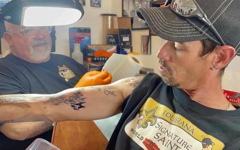 Devoted Who Dat reaches 100 Saints autograph tattoos on his torso: 'There  may not be much more skin' | Arts 