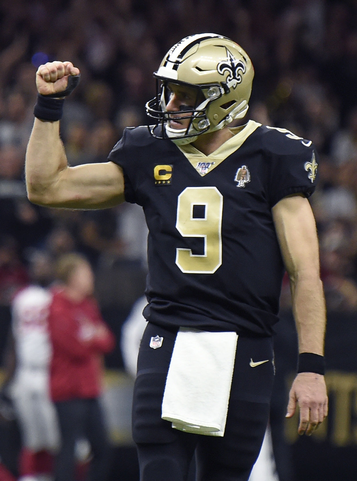 Drew Brees helps Steve Gleason onto the field to lead the WhoDat