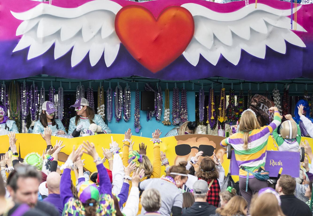 Photos Krewe of Iris rolls on the uptown parade route to the theme