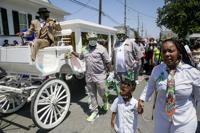 In green feathered suit, well-known Mardi Gras Indian queen Kim Boutte laid to rest