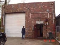 Willie Mackie outside Mackie Roofing warehouse