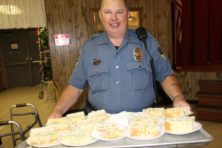 Westwego Police Chief Dwayne 'Poncho' Munch serves senior citizens