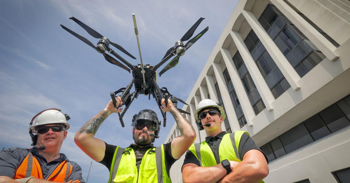 This company is flying 30-pound drones to clean New Orleans high-rises. Here's how they do it.