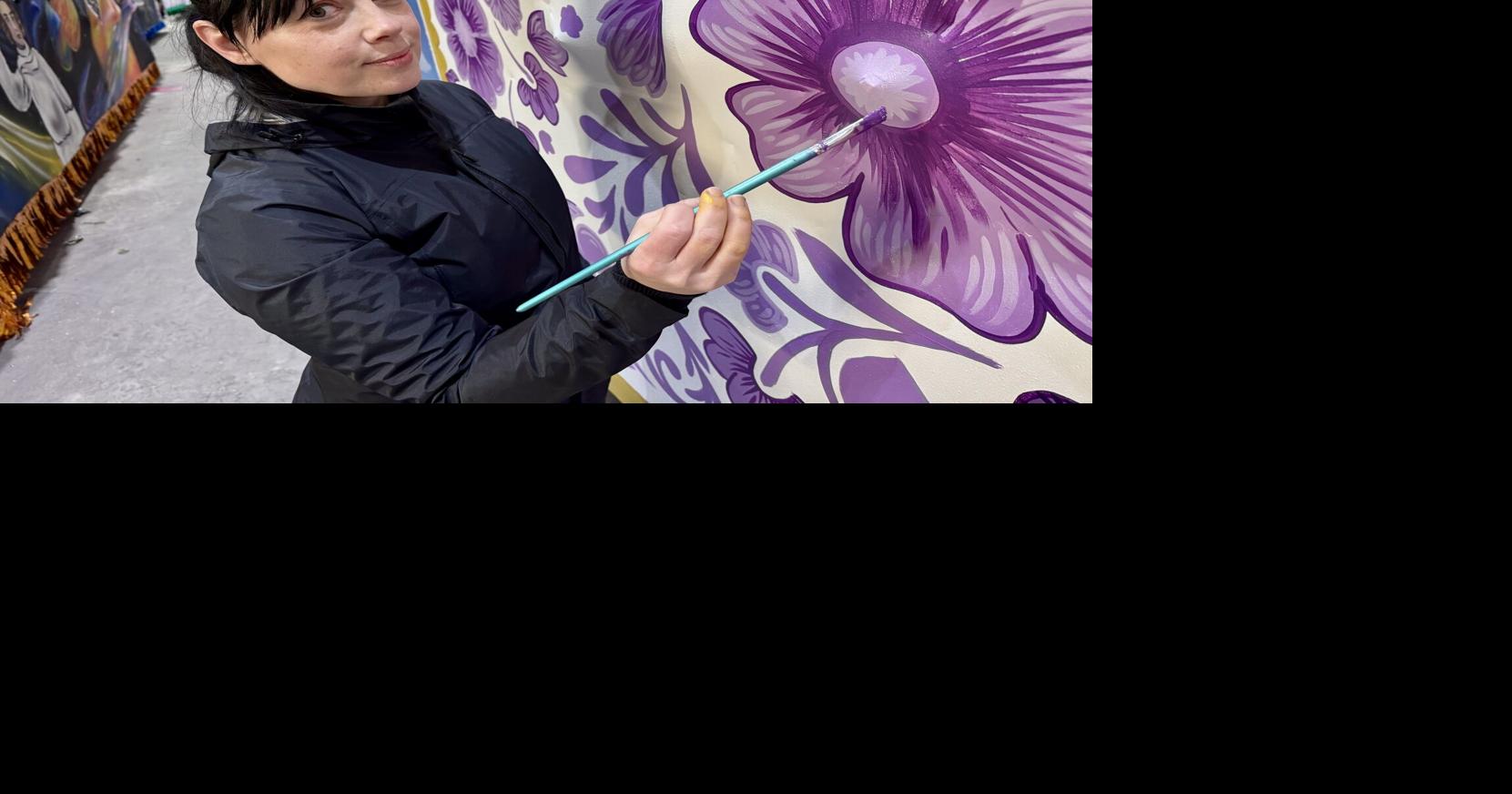 This Carnival queen is painting her own float for New Orleans' Krewe of Freret parade