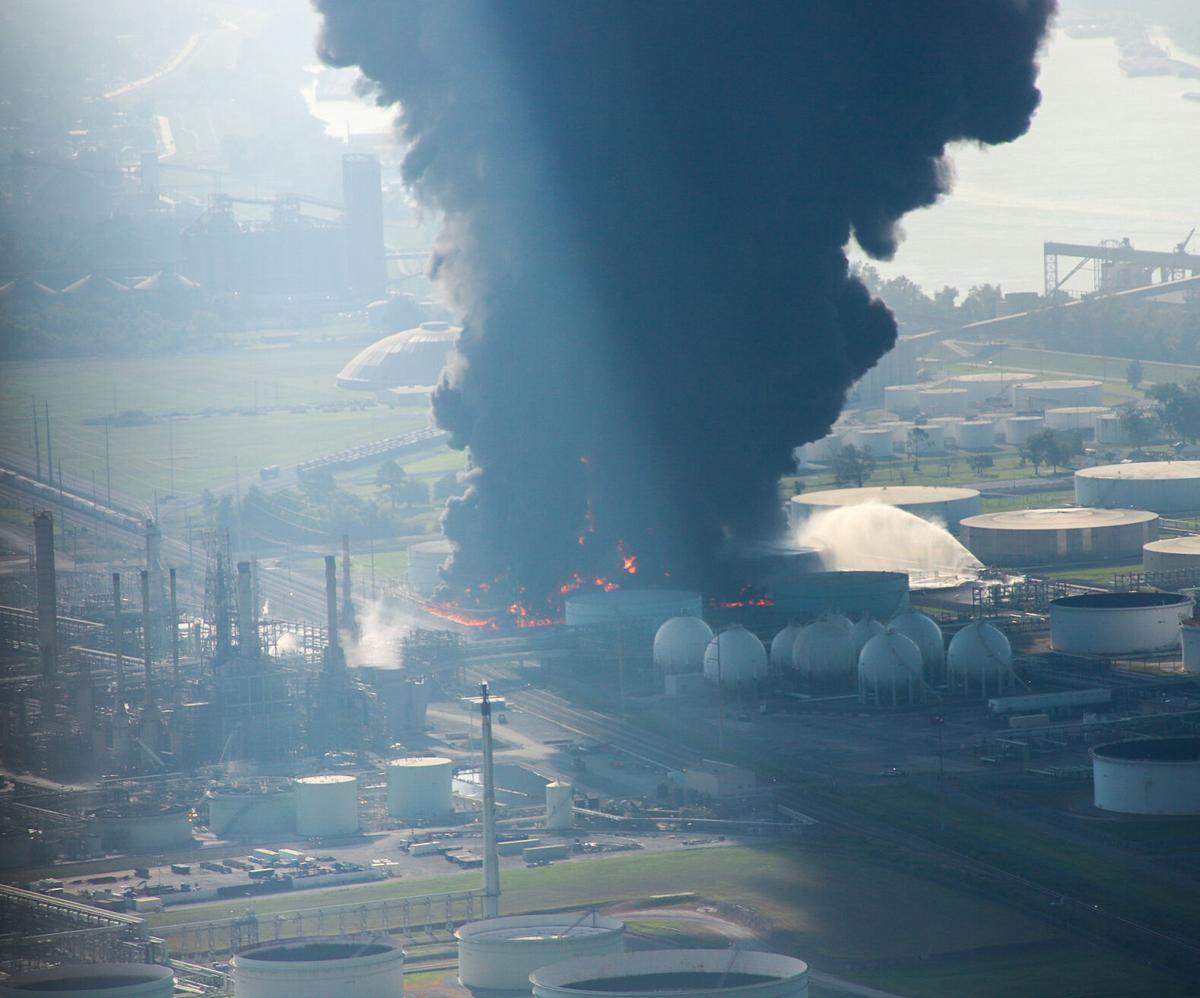 Photos Smoke billows from a tank fire at the Marathon Petroleum