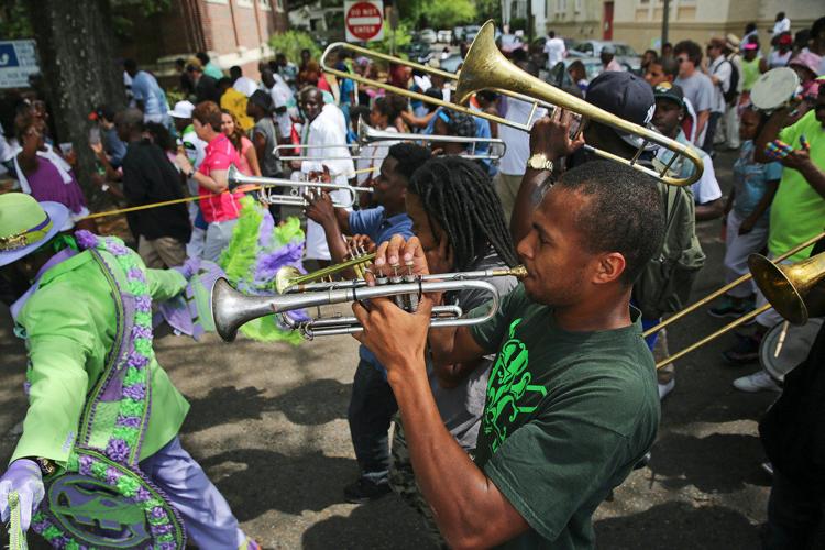 Pigeon Town Steppers' annual Easter secondline draws a lively crowd
