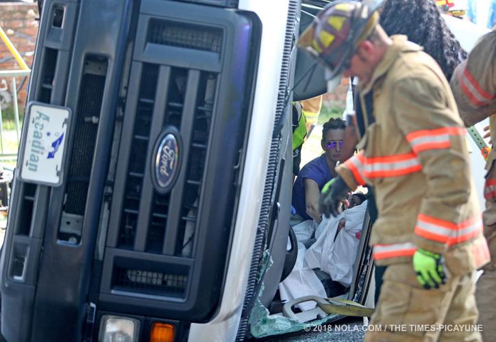 Medical transport van overturns in crash with SUV in Central City