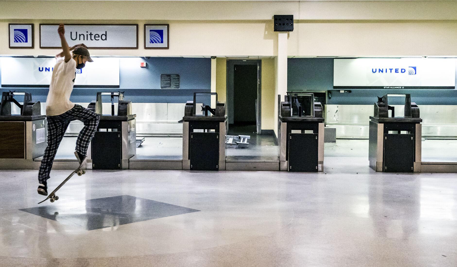 Photos Skateboarders fly through an abandoned MSY airport terminal in