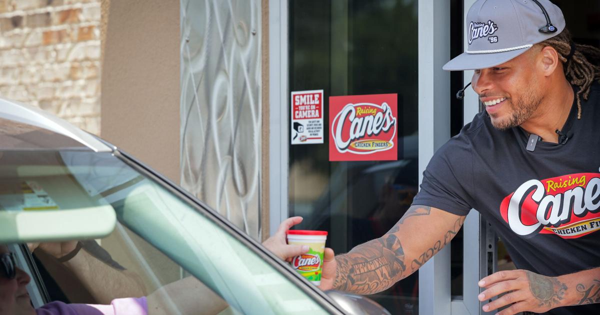 Photos: Tyrann Mathieu serves customers at Raising Cane’s to raise ...